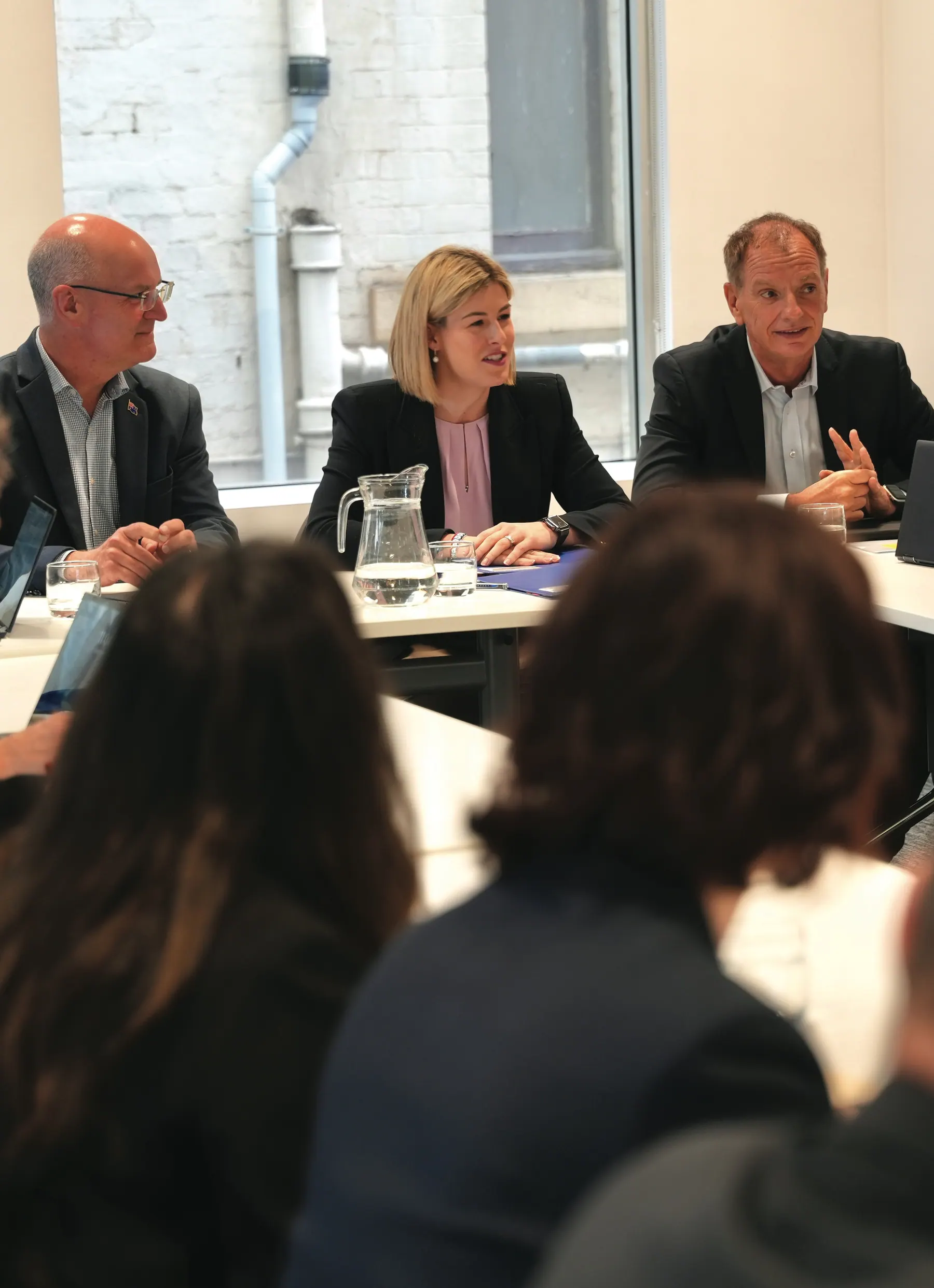 Jess Wilson leads a roundtable discussion with business representatives